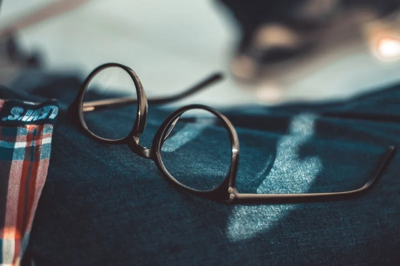 black-framed-eyeglasses-on-selective-focus-photo-1694208