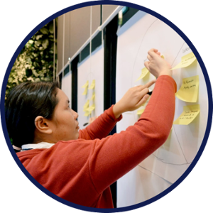 child writing on board